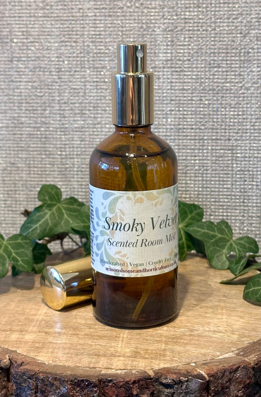 Smokey velvet room mist in an amber spray bottle with honey, spice, and sandalwood notes, creating a warm, cozy home fragrance perfect for gifts and relaxing ambiance