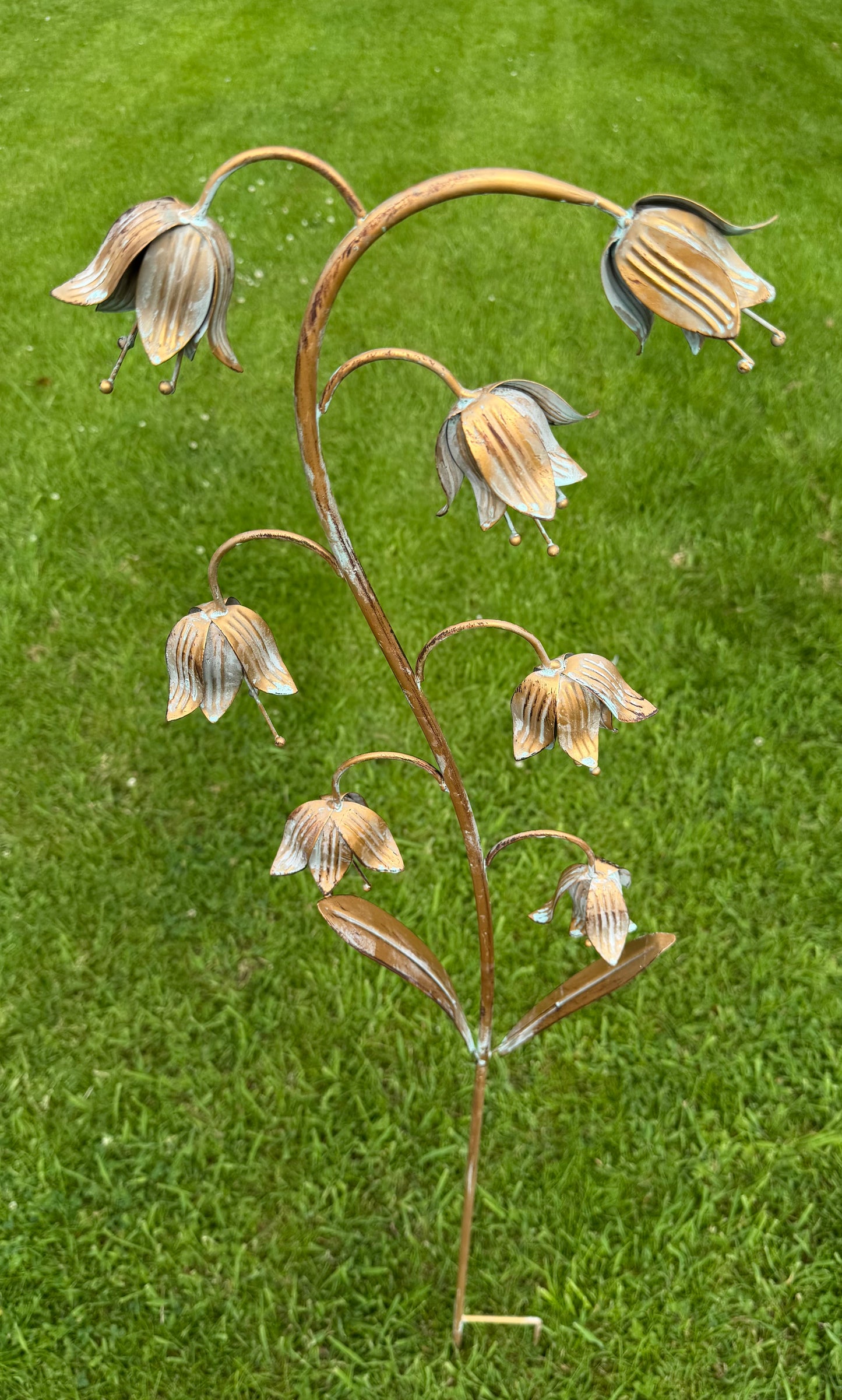 Decorative botanical garden stake with fritillaria flower design adding height and interest to outdoor spaces