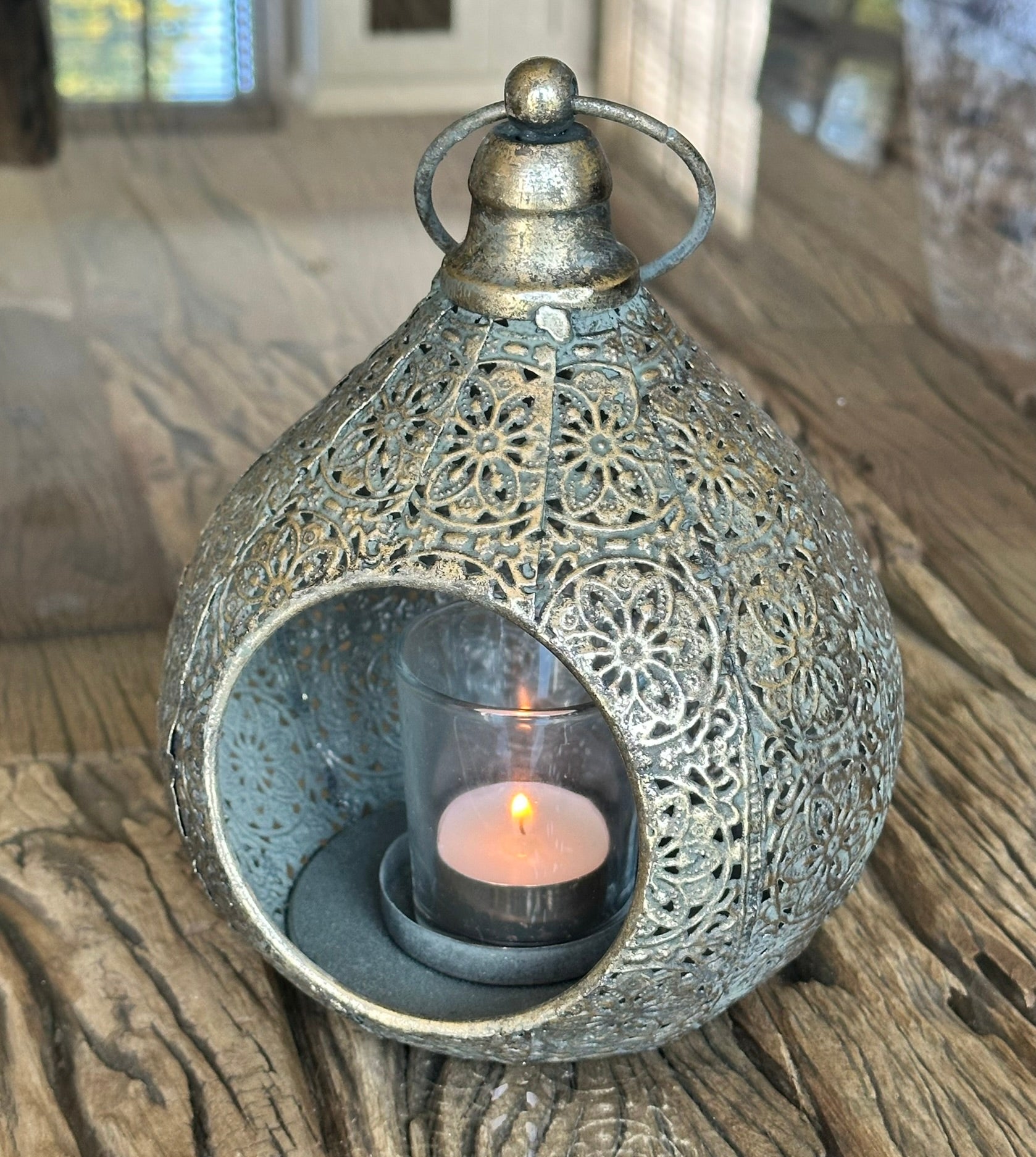 moroccan style metal detailed tealight holder in use with glass votive
