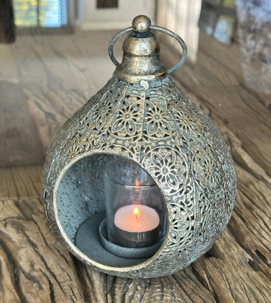 moroccan style metal detailed tealight holder in use with glass votive