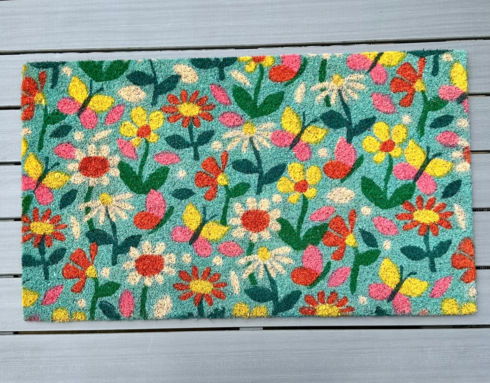 full view of the floral doormat