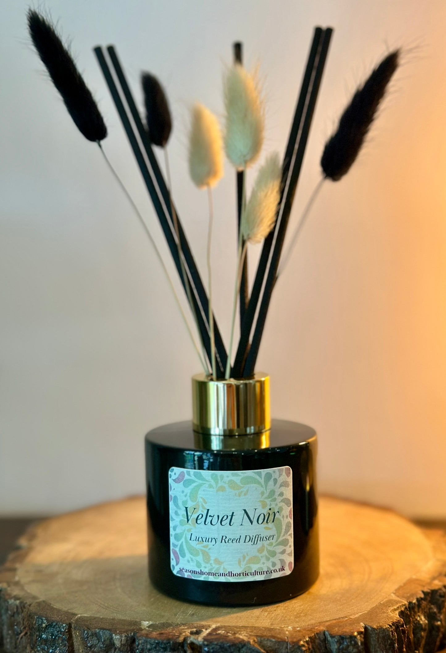 Handcrafted Velvet Noir diffuser in glass bottle, elegant tonka and vetiver aroma with citrus bergamot, vegan and paraben-free.