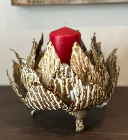Contemporary gold and white candle stand with leaf design for decorative or gift use

