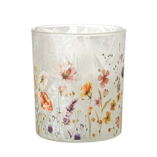 Glass candle holder with floral design on a white background