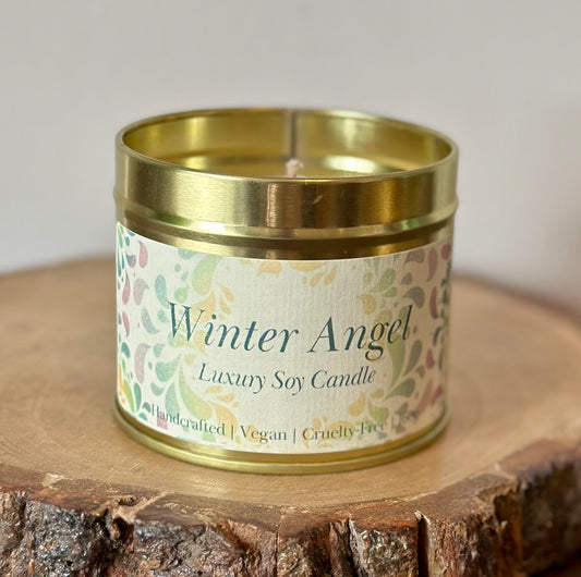 Handcrafted vegan soy candle in Winter Angel fragrance, clean burning and paraffin-free with notes of jasmine and amberwood.